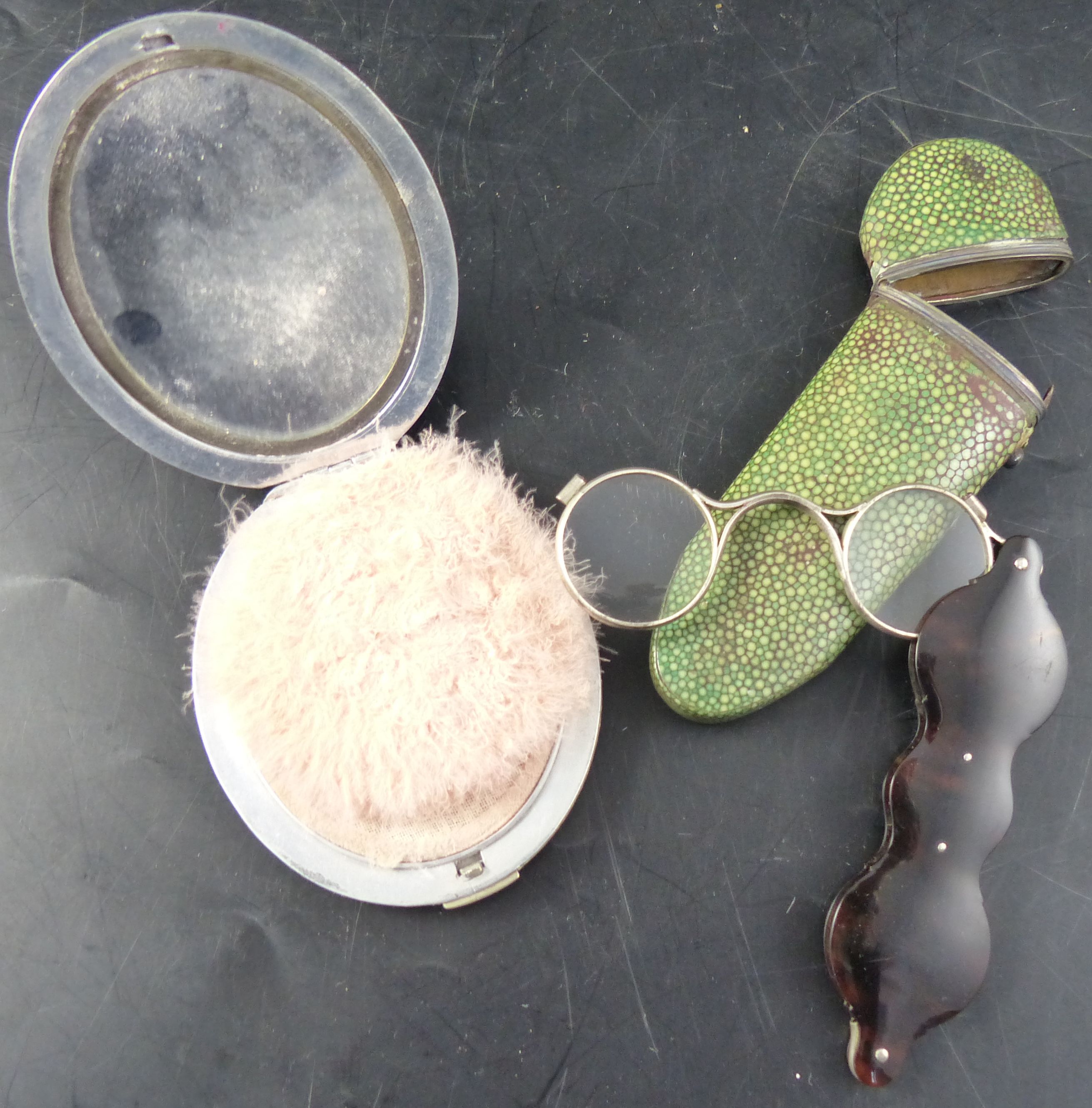 A pair of early 19th century silver and tortoiseshell lorgnette spectacles, and a compact